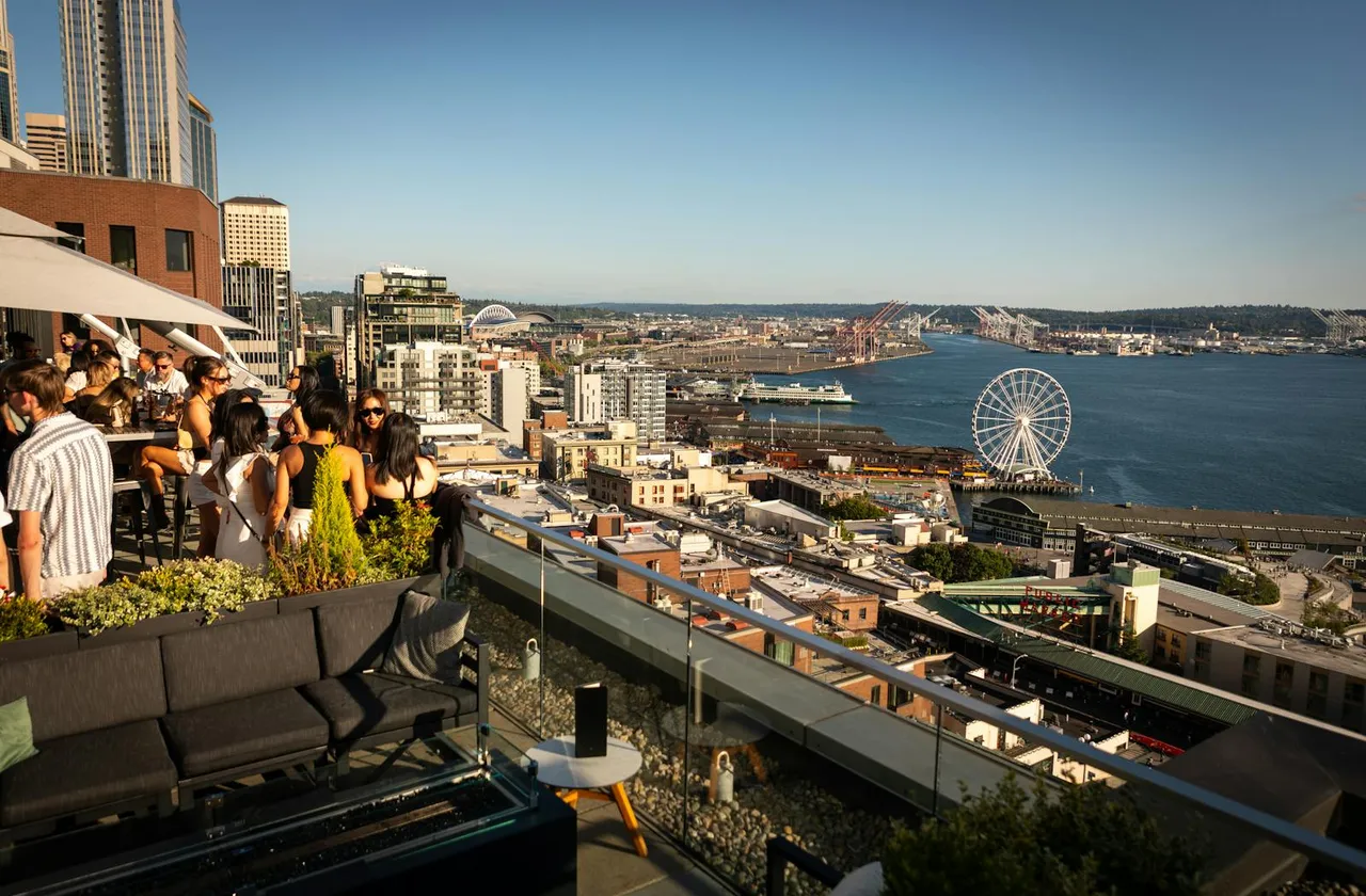 The Nest terrace overlooking Elliott Bay, the Great Wheel, and Pike Place Market